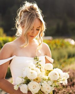 Beautiful bride holding flowers