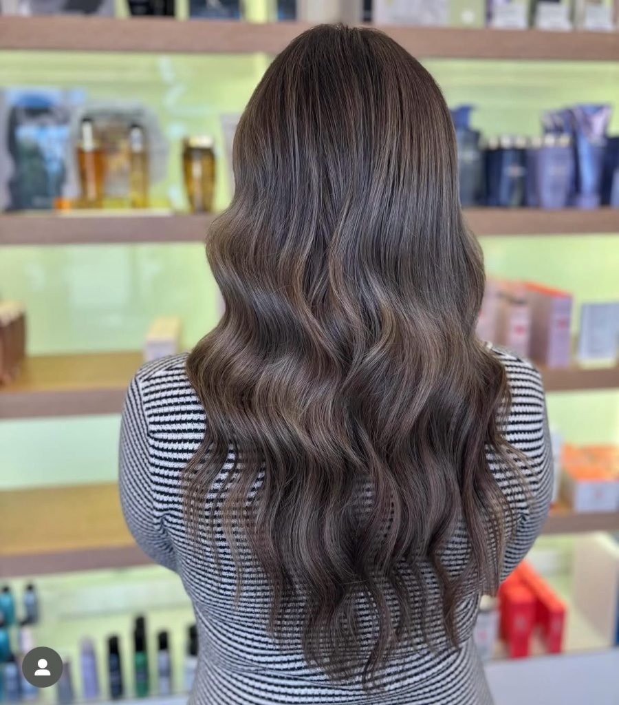 Long brunette hair viewed from the rear. Brunette balayage