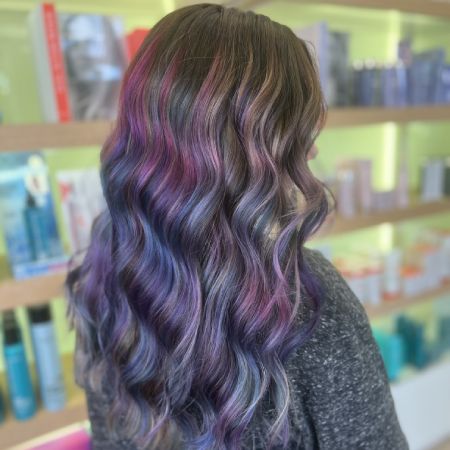 Long brunette hair with multiple colors shown from the rear.